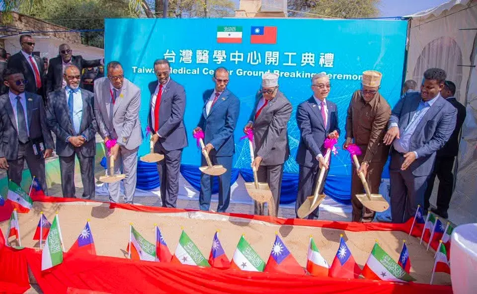 Officials holding ceremonial shovels at the ground-breaking of the Taiwan Medical Center, with Somaliland and Taiwan flags in the foreground